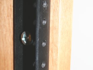 Threaded holes, spaced 5/8, 5/8, 1/2 inch (from bottom)